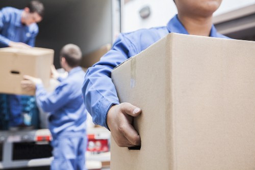 Man and van removals service in Soho with moving van and central London street scene