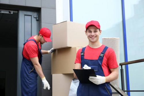 Man and van team loading furniture for a booking