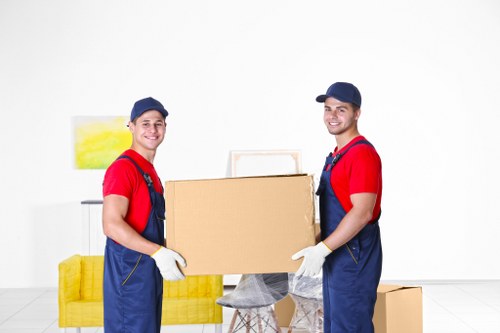 Professional movers handling furniture during a Soho relocation