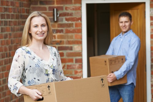 Moving home in Soho with packed boxes in a busy central London street