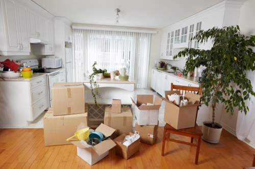 Packed boxes prepared for loading into a moving truck in Soho