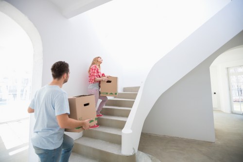 Careful packing for flat removals in Soho with labelled moving boxes