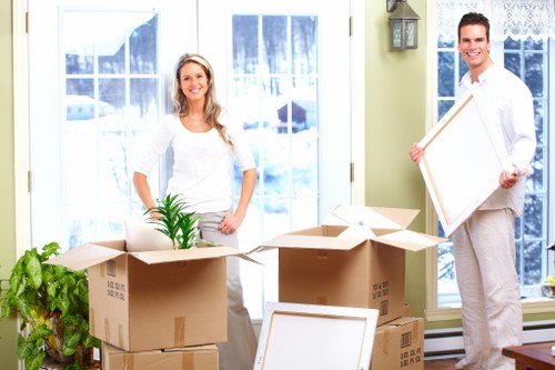 Small apartment move with furniture and boxes near busy central London properties